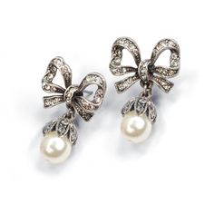 "These earrings feature our exquisite dimensional bows, set with 75 glimmering Swarovski crystals. 8mm pearls. Just the right size - demure and graceful. 1\" long by 0.75\" wide. Choice of Silver or Bronze finish. Post back. Designed and made in our Los Angeles studio. Matching piece: https://www.etsy.com/listing/215392898/bow-necklace-pearl-bow-silver-bow?ref=shop_home_active_1&ga_search_query=bow Contact us for bulk pricing and wholesale information." Jewelry Pearl Earrings, Bow Earring, Ribbon Earrings, Pearl Bow, Pearl Earrings Wedding, Bow Necklace, Bow Jewelry, Silver Bow, Earrings Pearl