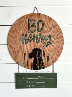 a wooden sign that says bo henry with a dog on it