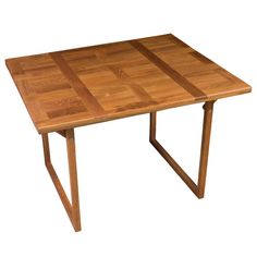 a small wooden table with two legs and a square shaped design on the top, sitting against a white background