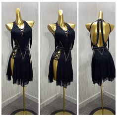 three mannequins dressed in black and gold with chains on their backs, one wearing a dress