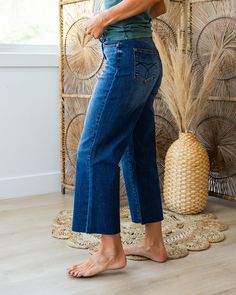 Judy Blue Patricia Non Distressed Cropped Wide Leg Jeans Dark wash Zip up Wide leg Cropped Embroidered detail on back pockets Fray hem Straight fit Great stretch 92% Cotton 6% Polyester 2% Spandex Imported Sizing: 0/24, 1/25, 3/26, 5/27, 7/28, 9/29, 11/30, 13/31, 15/32 Adrienne is a size 4 and is wearing a size 1 True to size for Judy Blue Straight Fit - size down if you are between sizes Need more sizing help? Check out our Jeans Sizing Guide here Measurements:10.5" rise (high rise)24" inseam ( Cropped Wide Leg Jeans, Fitted Jumpsuit, Active Jacket, Layering Tanks, Jeans Dark Wash, Hoodies For Sale, Fit Mom, Boyfriend Fit, Lounge Pants