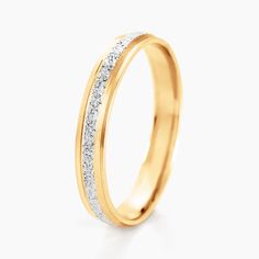 a yellow gold wedding ring with white diamonds on the outside and inside, against a white background