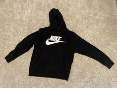 Nike Swoosh Logo Graphic Hooded Sweatshirt Hoodie Adult Medium M W/front Pocket. Please see photos before purchasing, all sales are final. My son outgrew this hoodie before he had a chance to wear it very much. It is used, preowned, and he wore it only a handful of times. It is black and has the classic Nike logo with swoosh in white. Convenient front pocket makes this hoodie a favorite. If you have any questions, please ask before purchasing. All sales are final, not a stock photo, what you see Best Hoodies For Men Nike, Nike Jumper, Black Nike Hoodie, Nike Women Sweatshirt, Nike Swoosh Logo, Nike Sweatshirts, Swoosh Logo, Nike Swoosh, Nike Hoodie