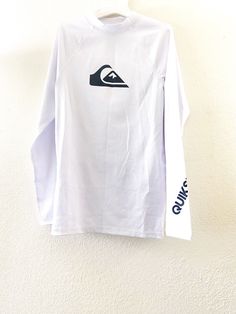 Quicksilver Unisex Kids Long Sleeve Active Mock Neck Tee with Logo, White, L (14) Feature: - 86% polyester, 14% elastane - Hand wash  - Hang dry Condition: New without tag  Shipping: Handling time: same day Fast shipping in 1-3 days with tracking number.  Returns/ Exchange: Please visit my store to check the return policy Welcome Offer! White Long Sleeve T-shirt With Branding, Basic White Moisture-wicking Top, White Moisture-wicking Cotton Top, Branded Long Sleeve Sports Top, Basic Long Sleeve Tops With Logo Print, Basic Long Sleeve Top With Branding, White Long Sleeve Shirt With Branding, White Moisture-wicking Long Sleeve T-shirt, White Long Sleeve Moisture-wicking T-shirt