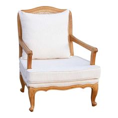 an old chair with white cushions and wood trimmings on the back, sitting in front of a white background