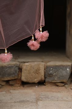 Featuring Onion Pink silk peplum with mirror, zardozi embroidered, paired with georgette inserted sharara and net choker dupatta with our signature hangings. Fabric - Silk, Georgette and net Components - 3 Colour - Onion Pink Embroidery details - Hand Embroidery Delivery time - 2-3 weeks Washing Instructions - Dry-clean Celebration Tissue Silk Set With Sheer Dupatta, Fusion Style Wedding Dupatta With Zari Work, Eid Celebration Organza Anarkali Set, Elegant Organza Sharara For Celebration, Celebration Sheer Dupatta Tissue Silk Sharara, Organza Sets For Celebration With Traditional Drape, Celebration Tissue Silk Sharara With Traditional Drape, Sharara With Sheer Dupatta In Organza For Celebration, Organza Sharara With Sheer Dupatta For Celebration