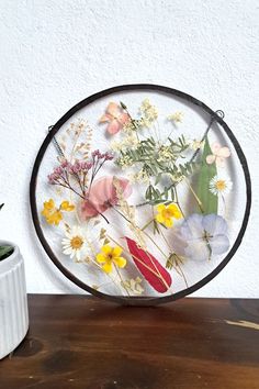 Circle glass frame with colorful pressed flowers inside. Flower Circle Frame, Shelf Decor Wall, Dreamy Meadow, Natural Shelves, Flower Circle