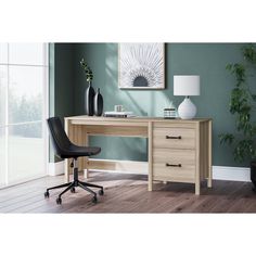 an office desk with two drawers and a chair in front of the desk, against a green wall