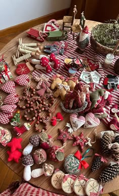 a wooden table topped with lots of christmas decorations