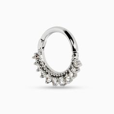 The Melia collection is edge-first with a side of grace. Inspired by the Etruscan art of granulation, this Melia Bead septum ring has small bead details above a row of white diamonds. Larger stones sit at the base of this nose ring, tapering into smaller stones on the ends. A locking hinge clasp secures the ring. Recycled metals White diamonds Approximately .13 total carat weight 8mm diameter Handcrafted and made-to-order Because every piece in our collection is made-to-order, designs can be mod Elegant Cubic Zirconia Septum Ring With Diamond Accents, Elegant Septum Ring With Prong Setting In Cubic Zirconia, Elegant Cubic Zirconia Septum Ring With Prong Setting, Elegant Hoop Septum Ring With Prong Setting, Elegant Septum Ring With Halo, Silver Diamond Septum Ring, Elegant Silver Septum Ring With Halo, Elegant Diamond Septum Ring With Accents, Elegant Diamond Septum Ring