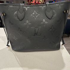 This Bag With Tax Totals 2879 See Picture Inserted. Only Wore A Couple Of Times. No Scuffs Tears Or Marks. Does Not Have Pouch. Comes With Dust Bag 12.2 X 11 X 5.5 Inches (Length X Height X Width) Black Embossed Cowhide Leather Cowhide-Leather Trim Microfiber Lining Gold-Color Hardware Hook Closure Inside Zipped Pocket 4 Side Laces Handle:Double Luxury Leather Bag With Monogram Print, Luxury Leather Bags With Monogram Print, Luxury Black Bag With Monogram Print, Luxury Black Bags With Monogram Print, Designer Black Bags With Monogram Print, Black Monogram Canvas Bag, Black Monogram Canvas Shoulder Bag For Evening, Black Monogram Canvas Evening Shoulder Bag, Evening Black Monogram Canvas Shoulder Bag