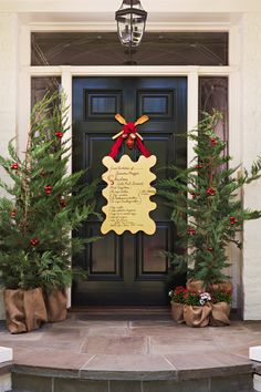 christmas decorations on the front door of a house