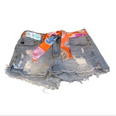 Color: Light Wash Denim Size: S Material: 93% Cotton 5% Polyester 2% Spandex Features: 5-Pocket Design Single Button Front W/ Zip Fly Frayed And Fringed Mid-Rise Waist Raw Hem Waist: 25” Hip: 32.5” Orange Denim Bottoms For Spring, Trendy Medium Wash Jeans For Vacation, Spring Orange Denim Bottoms, Casual Orange Summer Jeans, Casual Multicolor Denim Shorts, Casual Mid-rise Orange Bottoms, Spring Orange Jeans With Pockets, Orange Jeans For Spring, Multicolor Casual Jean Shorts For The Beach