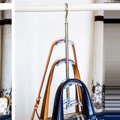 two pictures of purses hanging on a rack