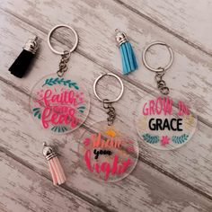 three keychains with the words grow in grace, faith and grace on them