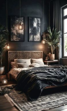 a bedroom with black walls and wooden furniture, plants on the floor and paintings above the bed