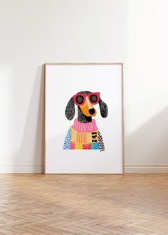 a dog with sunglasses and a sweater on is standing in front of a white wall