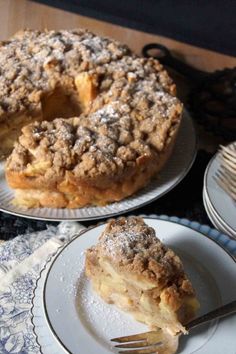 two plates with pies on them and one has a slice taken out of it