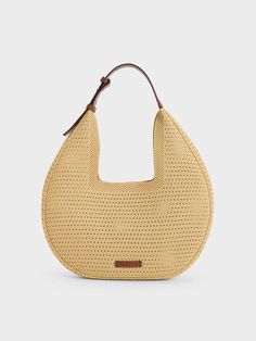 This product is made with at least 20% sustainable materials by weight. CHARLES & KEITH uses recycled, degradable, organic, and water-based materials in our eco-conscious collection. With a sleek curved silhouette and a capacious interior that will hold everything you need and more, this Ida hobo bag comes with a detachable pouch that will help keep your essentials neat and organised. Plus points for the wide angular opening -- secured by a magnetic closure -- that allows this piece to hang comfortably on your shoulder, but also offers easy access to your belongings. Neutral Bags, Europe Photos, Wallet Gifts, Charles Keith, Sustainable Materials, Eco Conscious, Kids Gifts, Bag Straps, Stripes Design