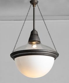 a light hanging from the ceiling in a room