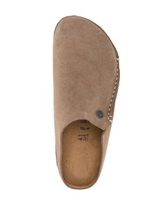 Zermatt Premium suede slippers from BIRKENSTOCK featuring taupe grey, calf suede, contrast stitching, logo plaque, embossed logo to the side, almond toe, slip-on style, branded insole and flat rubber sole. Size Info IT Color Detail Grey Made In Germany Material Lining: 100% calf suede Sole: 100% rubber Exterior: 100% calf suede Season One Fall-Winter Season Two Fall-Winter Product sandals Brand Birkenstock Size And Fit Narrow width Suede Closed Toe Slippers With Textured Footbed, Beige Suede Mules With Textured Footbed, Suede Slip-on Slippers With Textured Footbed, Comfortable Suede Slip-ons With Textured Footbed, Suede Closed Toe Slippers With Leather Footbed, Beige Suede Lined Slip-ons, Slip-on Suede Slippers With Textured Footbed, Suede Slip-on Mules With Textured Footbed, Beige Suede Slippers With Cushioned Footbed