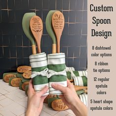 two wooden spoons with green and white stripes are stacked on top of each other