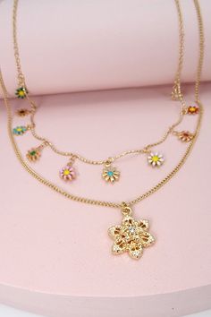 A Delightful, darling, charming, precious tiny epoxy flower charm double layered pendant necklace. These are great item to express a feminine "cuteness" for its appeal. Added elegant extender to fit your size in with class!DIMENSIONlength: 19", 16"charm size: .5" gold flower, epoxy: .25"ext: 3" Ball Chain Extclasp: Lobster Clawmetal finish: Gold Platedproduct: Lead & Nickel Compliantanti-tarnish: Double E-coating Cute Gold Jewelry With Flower Charm, Charming Gold Flower Necklace, Trendy Flower Necklace With Flower Charm Pendant, Trendy Flower Pendant Necklace With Charm, Trendy Flower Necklace With Flower Pendant, Cute Gold Necklace With Flower Charm, Cute Gold Flower-shaped Jewelry, Darling Charming, Flower Epoxy