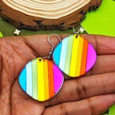 Handmade Rainbow Prismatic Shard earrings. Order with fishhooks to get the earring as pictured. If you would prefer ball post studs, leverbacks, or clip-ons, choose the appropriate option. All hardware is hypoallergenic stainless steel for sensitive ears. If you would like gold-toned metal, add it to the special instructions in your cart! Dimensions: 1.25 in (32 mm) L x 1.25 in (32 mm) W The drop length is about 1.75 in (45 mm). Materials: Acrylic Hypoallergenic Stainless Steel Posts Note: Mirror acrylic has a special reflective backing and cannot be the same color on both sides. Therefore the backs of these earrings are white. All items are handmade, please handle with care. Refer to this page for care instructions. For any other issues don't hesitate to contact us! Adjustable Multicolor Earrings With Lever Back, Retro Multicolor Earrings With Ear Wire, Multicolor Dangle Earrings With Lever Back Ear Wires, Unique Rainbow Earrings With Ear Wire, Rainbow Drop Earrings With Ear Wire, Rainbow Round Earrings For Pierced Ears, Unique Rainbow Earrings, Rainbow Metal Earrings, Hypoallergenic Rainbow Drop Earrings