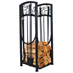 a stack of firewood in a metal rack with wrought iron designs on the sides