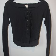 Tie At Top Buttons Down Shirt. There Is Braiding At The Top Of The Shirt. Tags Are Off Of Shirt But Never Worn. Black Casual Tops With Button Closure, Casual Black Tops With Button Closure, Casual Black Tops With Buttons, Shirt Tags, Cropped Button Down, Free People Long Sleeve, Free People Black, Long Sleeve Crop, Free People Tops