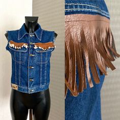 "Women's Vest Denim Vest Blue Denim Crop Vest Women Cropped Waistcoat Metal Buttons Country Western Cowboy Boho Fringed Denim Jacket Size S/M ♥ Women's Vest ♥ Brown fringes around ♥ Sleeveless ♥ 2 Front Pockets ♥ 6 Button up Closure Condition: Vintage Fair: Very Good condition Tag: Lois, Made in Spain-Valencia Materials: 100% Cotton Size: 42 ( Fit on S/M) See Masurements.. Measurements: Length : 49cm = 19,2\" Bust : 88cm = 34,6'' Waist : 76cm = 30'' **Measurements are taken with the garment lying flat. (Some sizes then doubled - Bust, Waist, Hips). Be sure to leave room for movement and comfort** Additional Notes: Please note that due to the nature of vintage clothing, ALL ITEMS ARE SOLD AS-IS; with no returns or exchanges, regardless of fit or condition. We try our best to give as much me Blue Denim Vest For Fall, Vintage Blue Denim Vest For Fall, Western Style Denim Blue Denim Top, Retro Blue Denim Vest For Fall, Denim Jacket With Pockets For Rodeo, Western Blue Denim Jacket For Fall, Retro Denim Vest For Fall, Western Style Denim Vest For Fall, Western Style Denim Blue Jacket For Fall