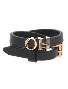 Editor's Note Built On The Reimagining Of The House Monogram, The O.H Monogram Black Wrap Leather Bracelet With A Signature Vegan Leather Double Strap Has Been Designed And Constructed At The Atelier. Enameled Alphabets Of ‘Oh’ In 22K Gold Plating Add An Irresistible Charm And Unmistakably Contemporary Beat. Material: Brass Plating: 22K Gold Plating Care: Store your jewelry in a box away from humidity or extreme surroundings. Use a dry cloth to clean it. About the Designer Outhouse With their un Bracelet Indian, H Monogram, Personal Shopping Service, The Atelier, Charms Necklace, Indian Fashion Designers, Pernia Pop Up Shop, Personal Shopping, 22k Gold