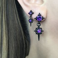 The Starburst stud earrings with Purple Glass stones are the perfect accessory for those who love gothic and celestial styles. The dreamy Blue stone  adds a touch of elegance, making them a beautiful addition for both men and women. With their unique design and high-quality materials, these earrings are a must-have for any fashion-forward individual. Sold as Pair Material: 316 Stainless steel Large stars: 36mm long /14 mm wide Small Stars: 22mm long/  9mm wide Standard post 21G Closure: butterfly push back Listing for pair of stud only *RETURNS / REFUNDS * -If you would like to return you purchase , please contact us within 7 days of receiving your package and we will accept the return.Return will only be made to the product, and not the shipping cost.  -Buyer is  responsible for the retur Cheap Purple Star-shaped Jewelry, Edgy Star-shaped Pierced Earrings, Gothic Star-shaped Pierced Earrings, Edgy Star-shaped Earrings For Gift, Men's Earrings, Small Stars, Earrings Gothic, Starburst Earrings, Gothic Earrings