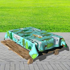 a picnic table covered with a blue camper trailer design