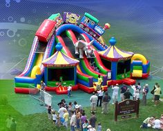 an inflatable bounce house with people standing around it