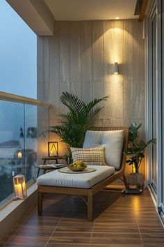 a balcony with a chair, table and potted plant on the ledge next to it