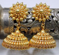 Vintage 22 karat solid gold detailed workmanship dangle earring pair (jumkee). total weight of pair-16.5 grams(0.58 ounces), length-4 cm, diameter of bottom-2.2 cm,, material-22 k solid gold. Antique Heavy Gold Earrings, Heavy Yellow Gold Temple Jewelry Earrings, Yellow Gold Brass Jhumkas For Festivals, Festival Yellow Gold Brass Jhumkas, Yellow Gold Dangle Jhumkas With Intricate Design, Yellow Gold Intricate Dangle Jhumkas, Festive Yellow Gold Brass Jhumkas, Temple Jewelry Style Yellow Gold Round Danglers, Yellow Gold Temple Jewelry Jhumkas