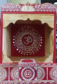 an intricately painted wooden box on display