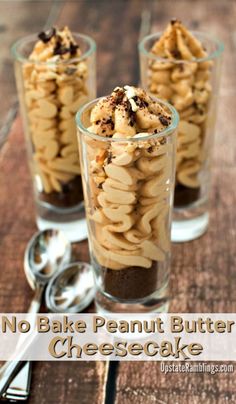 no bake peanut butter cheesecake cups on a wooden table with spoons and forks