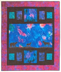 a quilted wall hanging with two deers in the night sky and trees behind it