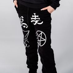 Unisex "Jogger" Style Sweatpants from Forbidden Alchemy. Designed for both comfort and style, these slim-fitting joggers feature a tapered ankle for a sleek silhouette that flatters all body types. Crafted from a premium blend of 80% cotton and 20% polyester, they offer the perfect balance of softness and durability, ensuring all-day comfort and long-lasting wear. Slim Fit: Tailored to hug your body while allowing ease of movement. Tapered Ankle: Provides a modern, streamlined look. Premium Fabr Baggy Pants With Comfort Waistband For Streetwear, Hip Hop Style Stretch Bottoms For Jogging, Streetwear Joggers With Comfort Waistband And Tapered Leg, Streetwear Bottoms With Comfort Waistband, Hip Hop Stretch Bottoms For Jogging, Stretch Hip Hop Bottoms For Jogging, Fitted Cotton Joggers For Streetwear, Fitted Harem Pants For Streetwear, Casual Fitted Harem Pants For Streetwear