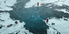 several people in small boats floating on ice