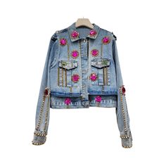 Expertly crafted with handmade rhinestones and rivets, this slim fit short denim jacket is the epitome of style and quality. Featuring a sleek and flattering fit, this jacket is perfect for adding a touch of glamour to any outfit. - Color: Purple, White, Multicolor- Style: Denim Jacket- Pattern Type: Solid- Sleeve Length: Long Sleeve- Fabric: Polyester- Closure Type: Buttons- Details: Rhinestones, Rivet- Occasion: Casual- Gender: Women- Size: M, L (Unit: cm)M：Length：49 | Shoulder：39 | Bust：104 | Spring Long Sleeve Outerwear With Rhinestone Rivets, Trendy Fitted Outerwear With Studs, Fitted Denim Jacket With Rivets For Fall, Fall Fitted Denim Jacket With Rivets, Fitted Spring Outerwear With Rivets, Fitted Denim Jacket For Spring Parties, Trendy Fitted Outerwear With Rhinestone Rivets, Fitted Denim Outerwear With Rhinestones, Party Denim Jacket Embellished