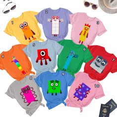 Numbers Blocks Matching Shirt, Blocks Color Matching Shirt Fun Cotton Tops With Graphic Design, Summer Crew Neck Shirt With Character Print, Summer Multicolor Character Print T-shirt, Playful Short Sleeve Cartoon Print Top, Graphic Tee With Character Print And Short Sleeves, Playful Short Sleeve Top With Cartoon Print, Multicolor Cartoon Print Crew Neck Top, Funny Short Sleeve Tops With Graphic Design, Casual Multicolor Character Print Tops