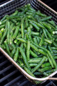 green beans are being cooked on the grill