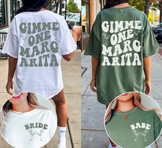 two women wearing tshirts that say gimme one mag arta