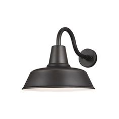 an outdoor wall light with a black metal shade on it's head and arm