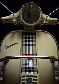 the front end of a scooter with a checkered design