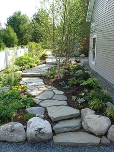 a stone path in front of a house