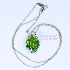 Very pretty Peridot pendant necklace, set with diamonds and in platinum. This peridot is fine quality and a large 13.62 carats in weight and very gemmy clean! The necklace is 18 inch maximum adjustable to any smaller length. A few diamonds adorn the sides of the peridot.Total Weight: 11.71 gramsFace Size: 1 inch x 0.7 inchPrecious Metal: Platinum (pendant and chain necklace)Precious stones:-Peridot Center Stone: 13.62 carats, 16mm x 13.8mm-White Diamonds: 0.29 caratsHallmarks: Pt900, 13.62, D.29 Green Diamond Necklace For Formal Occasions, Oval Peridot Jewelry For Formal Occasions, Luxury Green Diamond Necklace As Gift, Green Oval Necklace With Diamond Accents, Formal Peridot Jewelry For May Birthstone, Fine Jewelry Peridot For Formal Occasion, Green Pendant Diamond Necklace For Formal Occasions, Formal Fine Jewelry With Peridot, Formal Green Gemstone Diamond Necklace